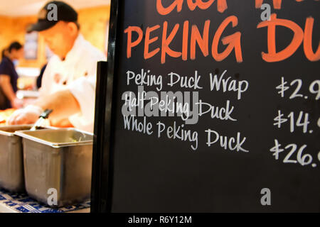 Fairfax, VA USA. Jul 2014. A Chinese menu chalkboard  advertising delicious Peking Duck. Large groceries are catering to more diverse ethnic foods. Stock Photo