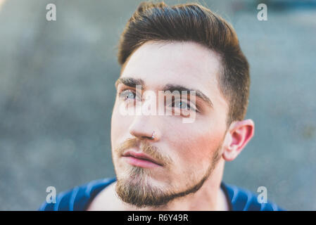 Adorable young man thinking in his lover Stock Photo