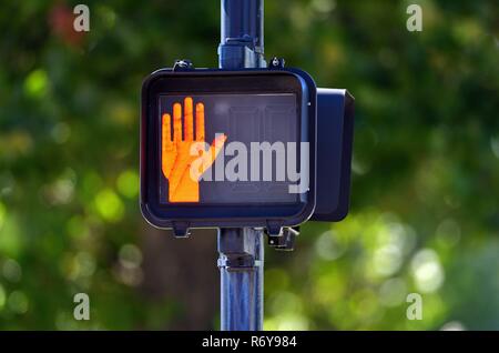 Geneva, Illinois, USA. A sign at a crosswalk directing pedestrians when it is safe to walk across the street. Stock Photo