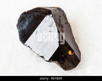 raw crystal of Cassiterite stone on white Stock Photo