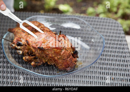 grilled juicy beef meat. meat on a plate at a picnic Stock Photo