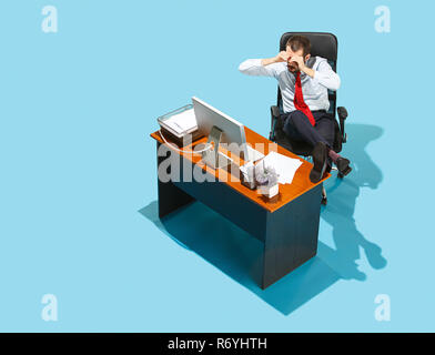 Shot from above of a stylish business man working on a laptop. Stock Photo
