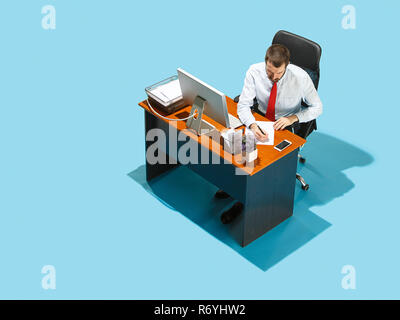Shot from above of a stylish business man working on a laptop. Stock Photo