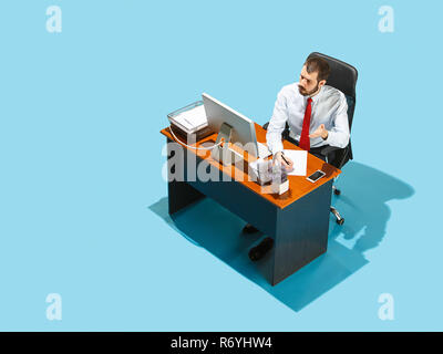 Shot from above of a stylish business man working on a laptop. Stock Photo