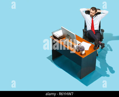 Shot from above of a stylish business man working on a laptop. Stock Photo