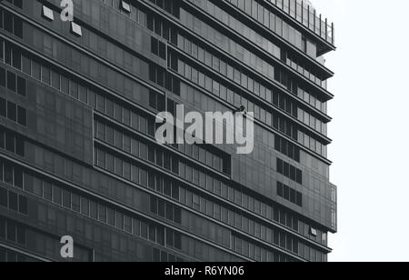 Multi-storey office building with worker cleaning glass window Stock Photo
