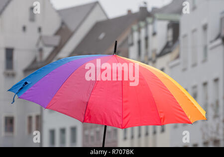 Open rainbow coloured umbrella Stock Photo