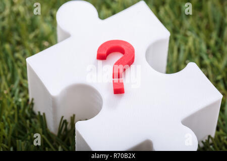 Red Question Mark Sign On Jigsaw Puzzle Stock Photo