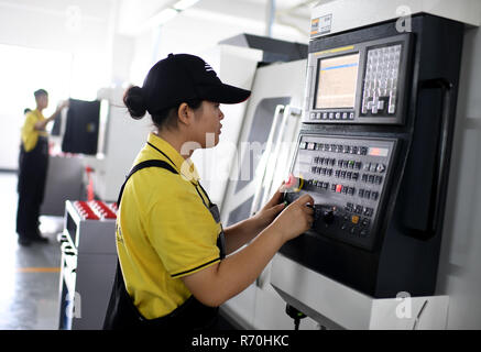 06 December 2018, China, Kanton (guangzhou): Apprentices at the vocational training centre for industrial mechanics and mechatronics 'Man Sum'. Photo: Britta Pedersen/dpa-Zentralbild/dpa Stock Photo