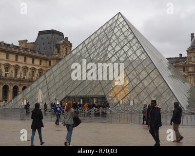 07 December 2018, France (France), Paris: No visitors stand in front of the pyramid in the courtyard of the Louvre Museum, which houses Leonardo da Vinci's Mona-Lisa. The world-famous museum will remain closed on Saturday because of the protests in the capital. Photo: Christian Böhmer/dpa Stock Photo