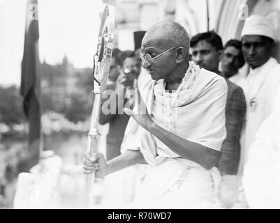 Mahatma Gandhi talking on microphone from a train compartment, Madras ...