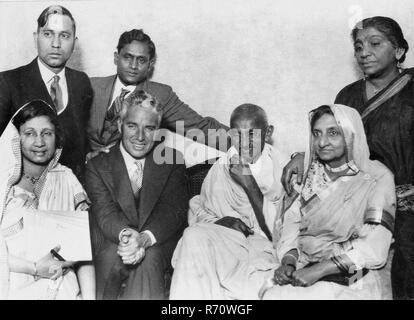 Mahatma Gandhi with Charlie Chaplin the film actor (seated, left) and ...