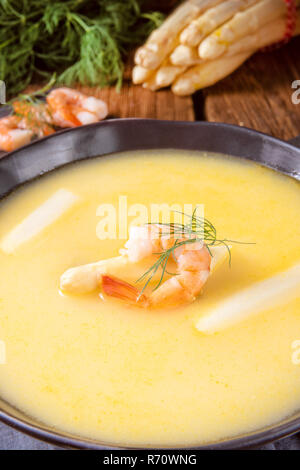 delicious asparagus cream soup with prawns and fresh dill Stock Photo ...