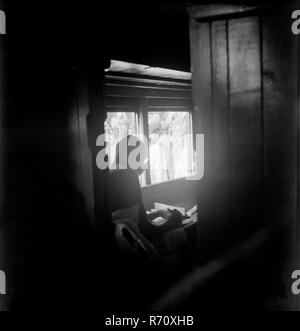 Mahatma Gandhi writing in a train compartment, India, 1947, old vintage 1900s picture Stock Photo