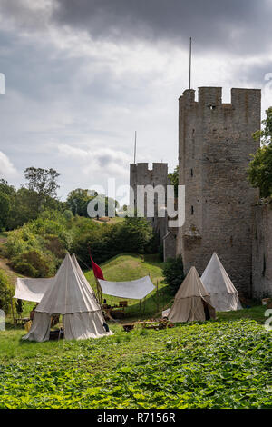Tent camp, medieval week, medieval city wall with defensive towers, Unesco World Heritage Site, Visby, Gotland Island, Sweden Stock Photo
