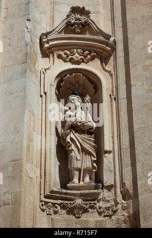 Figure on the portal of the Basilica of San Martino, Martina Franca, Apulia, Italy Stock Photo