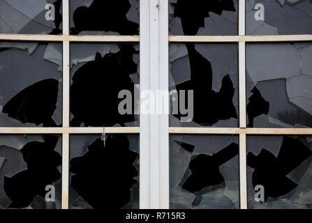 Broken window with glazing bars, single panes broken, old building, Saxony, Germany Stock Photo