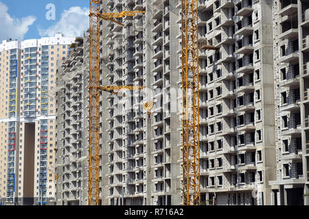 New high-rise modern apartment buildings construction in process ob bright sunny day side view horizontal Stock Photo