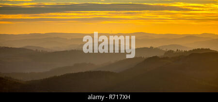 Sunset over wooded hills near Sundern, Sauerland, North Rhine-Westphalia, Germany Stock Photo