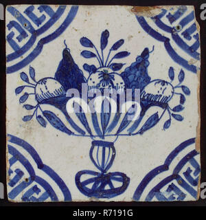 White tile with blue fruit bowl on stand, apples and grapes; corner pattern meander angle, wall tile tile sculpture ceramic earthenware glaze, baked 2x glazed painted Red shard square three and four nail holes. AVIa chinoiserie Stock Photo