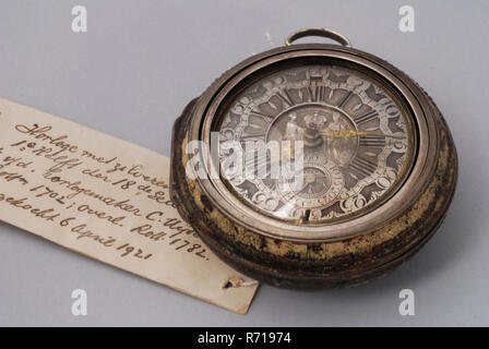 Cornelis Uyterweer, Pocket watch with protective case with imitation tortoise painting and silver dial with date calendar and golden hands, pocket watch watch movement instrument silver brass steel glass textile copper gold exterior cupboard, Dial: silver champlevé with Roman numerals for the hours and Arabic numerals for the minutes. Minute band with so-called 'Dutch' bows. Declaration of seconds on separate ring under the pointer with arabic numbers. signature in recess thereof. In the center of the dial the image of royal couple Deepens hands with crown above it. On the outside of this the  Stock Photo