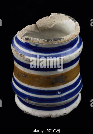 Albarello, ointment jar, with polychrome circle decoration, albarello holder soil find ceramic earthenware glaze tin glaze, hand turned baked glazed decorated baked Albarello with three necking. Cylindrical pot on stand surface Fully glazed except the bottom of the bottom and the neck edge Yellow shard. Decoration consists of an orange band in the middle and blue ties archeology health care indigenous pottery packing ointment pharmacy craft medicine drug Stock Photo