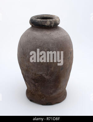 Pottery pot on stand, baluster shape, used in the sugar industry, sugar bowl pot holder soil find ceramic earthenware glaze lead glaze, hand turned glazed baked Pottery pot on stand. Baluster shape with round shoulder and narrow neck opening. Thick and round neckline. Smooth finished. Red shard and internally glazed dark glaze. Hard baked. Here sugar cones were made archeology indigenous earthenware sugar confectionery sugar industry Stock Photo