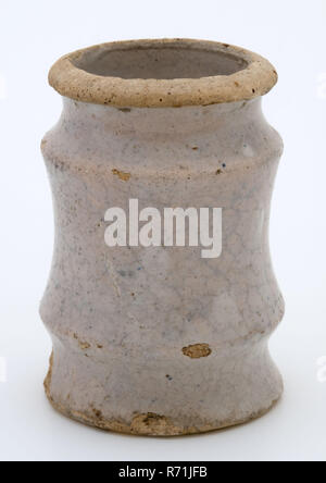 Pottery ointment jar, lightly tapered with three necking, white pink glazed, ointment jar pot holder soil find ceramic earthenware glaze tin glaze, hand turned baked 2x glazed Pottery ointment jar slightly tapered with wider base and three necking Fully glazed pink glazed. Plank with soul So-called Delftware in the form of an albarello archeology health care indigenous pottery packing pharmacy store selling medicine medicament craft Stock Photo