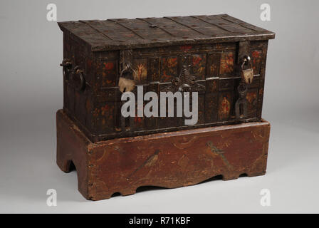 Painted wrought iron Nuremberg chest, archive case casket cabinet furniture furniture interior fittings iron paint, Iron box with outside band iron fastened with rivets; two large handles on both sides turned halfway; two transfer wackets at the front which can be pushed over the protruding staples but which now hang downwards; to the two staples are two closed padlocks attached with half oval disc-shaped lock cases with locking wackets On the front star-shaped fake key plate of driven iron for decoration. Lid can be opened with the help of key that is inserted into the keyhole, placed central Stock Photo