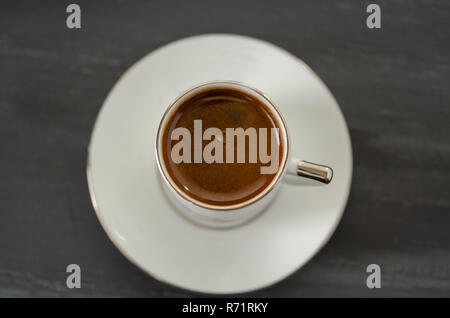 Turkish Coffee in White Porcelain Cup Top View Stock Photo