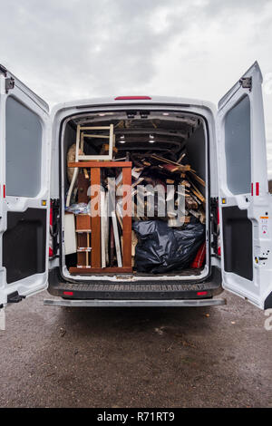 White work van full of debris and on its way to recycling Stock Photo