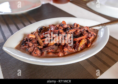 Traditional Filipino Food - Pusit Adobo Stock Photo