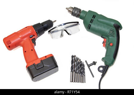 Drill and screwdriver on a white background Tools on a white background. Isolated objects. Items for repair and collection of furniture. Stock Photo
