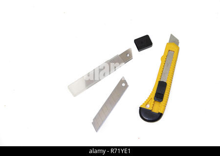 Construction knives on a white background Tools on a white background. Isolated objects. Items for repair and collection of furniture. Stock Photo