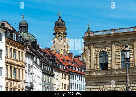 renovated old buildings in munich with the theatinerkirche in the background Stock Photo