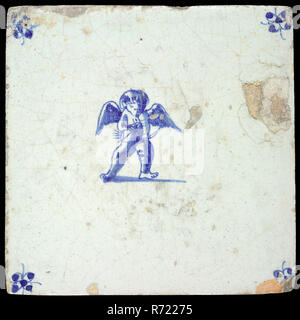 Figure tile, standing cupid with bow and arrow, blue decor on white ground, corner fill spider, wall tile tile sculpture ceramic earthenware enamel tinglage, in form made baked glazed painted baked Wall tile with blue decor on white background. Figure tile with cupid Central representation of standing cupid with an arrow and bow He tightens the bow but the arrow is still facing down Orange-brown shard Scraped earthenware. Corner filling spins Slightly slanted sides. Stock Photo