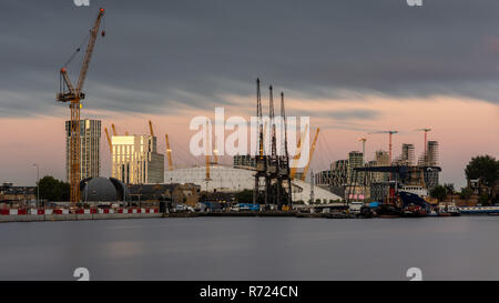 London, England, UK - September 14, 2018: Cranes stand over construction sites at Wood Wharf and North Greenwich in London's Docklands urban regenerat Stock Photo