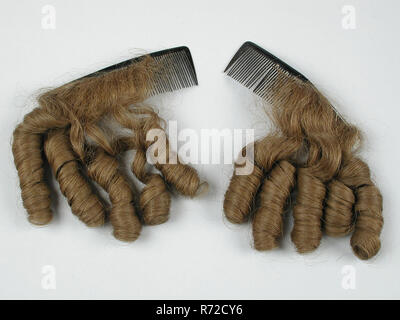Two hairpieces with pipe shavings on curved black plastic Comb, hairpiece hair comb hair accessory hair turtle? plastic? celluloid?, Two black combs slightly curved each comb provided with five brown pipe curls formed from real hair women hair caps adorn pipe curls Stock Photo