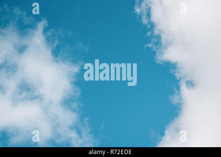 Blue sky with fluffy clouds Stock Photo