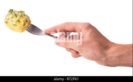 Hand holds a fork on which the young boiled potatoes in dill isolated on white background. Clipping Path. Full depth of field. Stock Photo