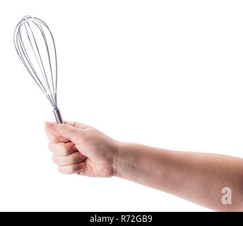 Female holding in hand whisk isolated on white background. Clipping Path. Full depth of field. Stock Photo