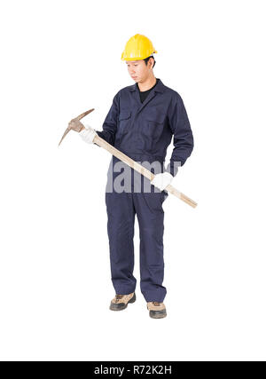 Man in uniform hold old pick mattock that is a mining device Stock Photo