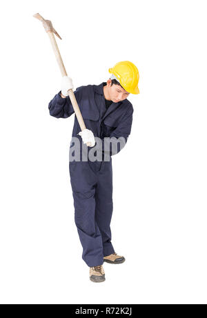 Man in uniform hold old pick mattock that is a mining device Stock Photo