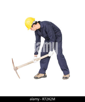 Man in uniform hold old pick mattock that is a mining device Stock Photo