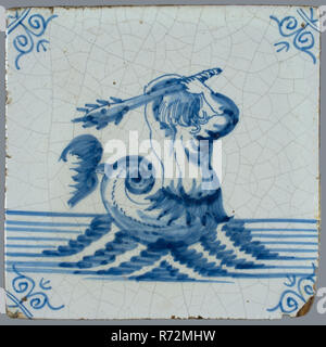 Scene tile, in tile field of eight, four high, two wide; sea creature tile in blue, meerman with club at sea, corner motif ox's head, tiled field wall tile tile visuals component ceramics earthenware glaze tin glazing, baked 2x glazed painted Blue on white. Tile in tile field of eight pieces four high two wide mythology Stock Photo