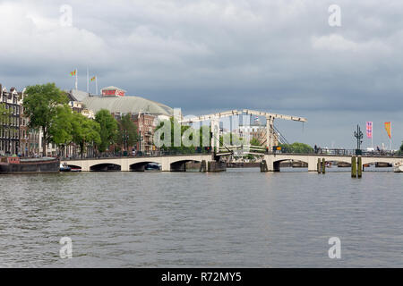 View at Magere Brug, famous Dutch bridge in Amsterdam Canals Stock Photo