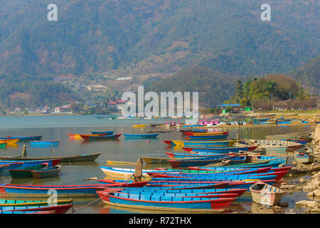 Colorful boats on Phewa Lake, Pokhara, Nepal Stock Photo