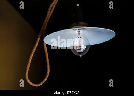 Historic hanging lamp with Edison-style lightbulb Stock Photo