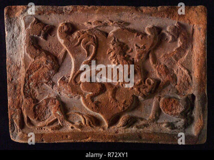Hearthstone, from Antwerp Belgium, with narrow frame, with coat of arms, hearth fireplace part ceramic brick, fired Hearth stone of the Antwerp type with narrow frame depicting coat of arms with lion flanked by two griffons building history heating heraldry Stock Photo