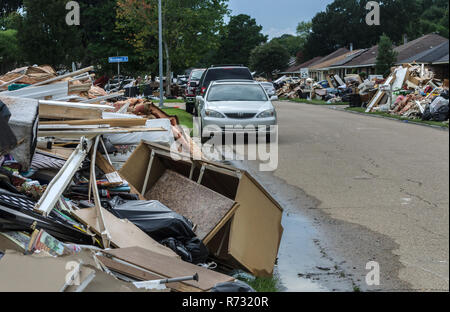 Unsalvageable household items line the curbs of Woodwick Avenue after the flood, Aug. 21, 2016, in Baton Rouge, Louisiana. Stock Photo